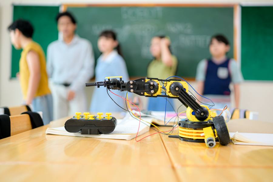 Students exploring robotics together in a classroom